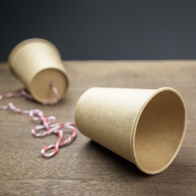 Picture of two paper cups connected by a string
