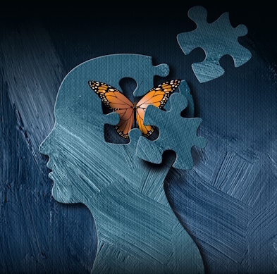 Butterfly emerging from an abstract image of a human head